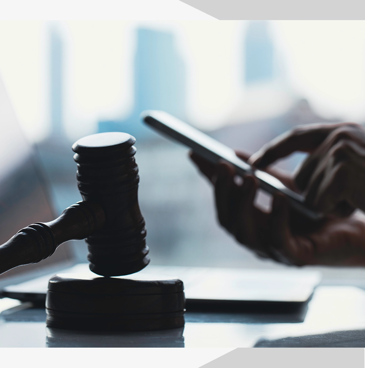 A judge 's gavel sitting on top of a table.